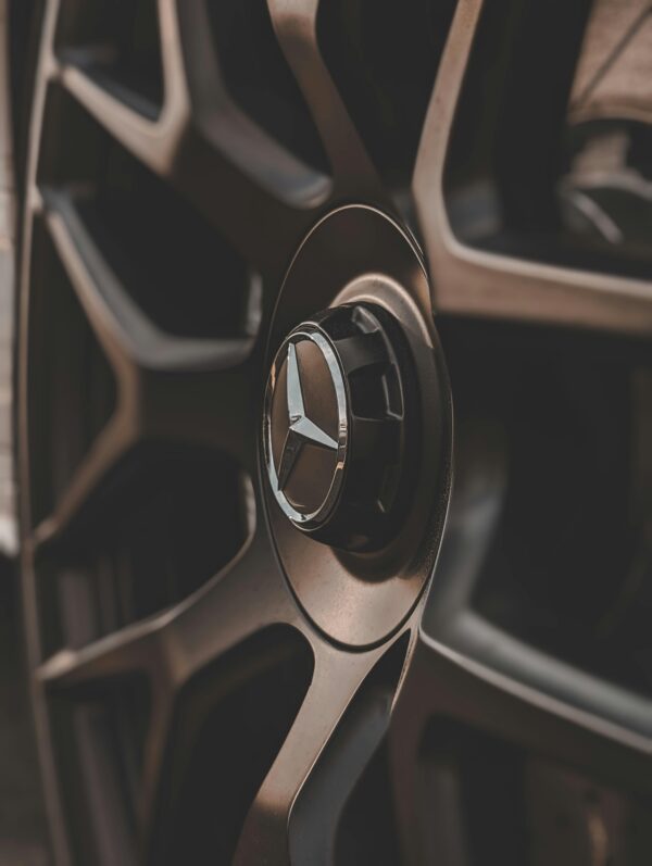 Detailed image of a car wheel rim showcasing a modern and metallic design.